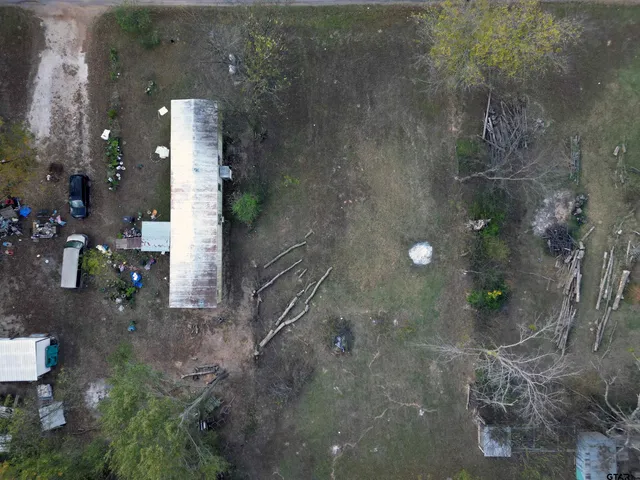 a partial view of a house with a yard