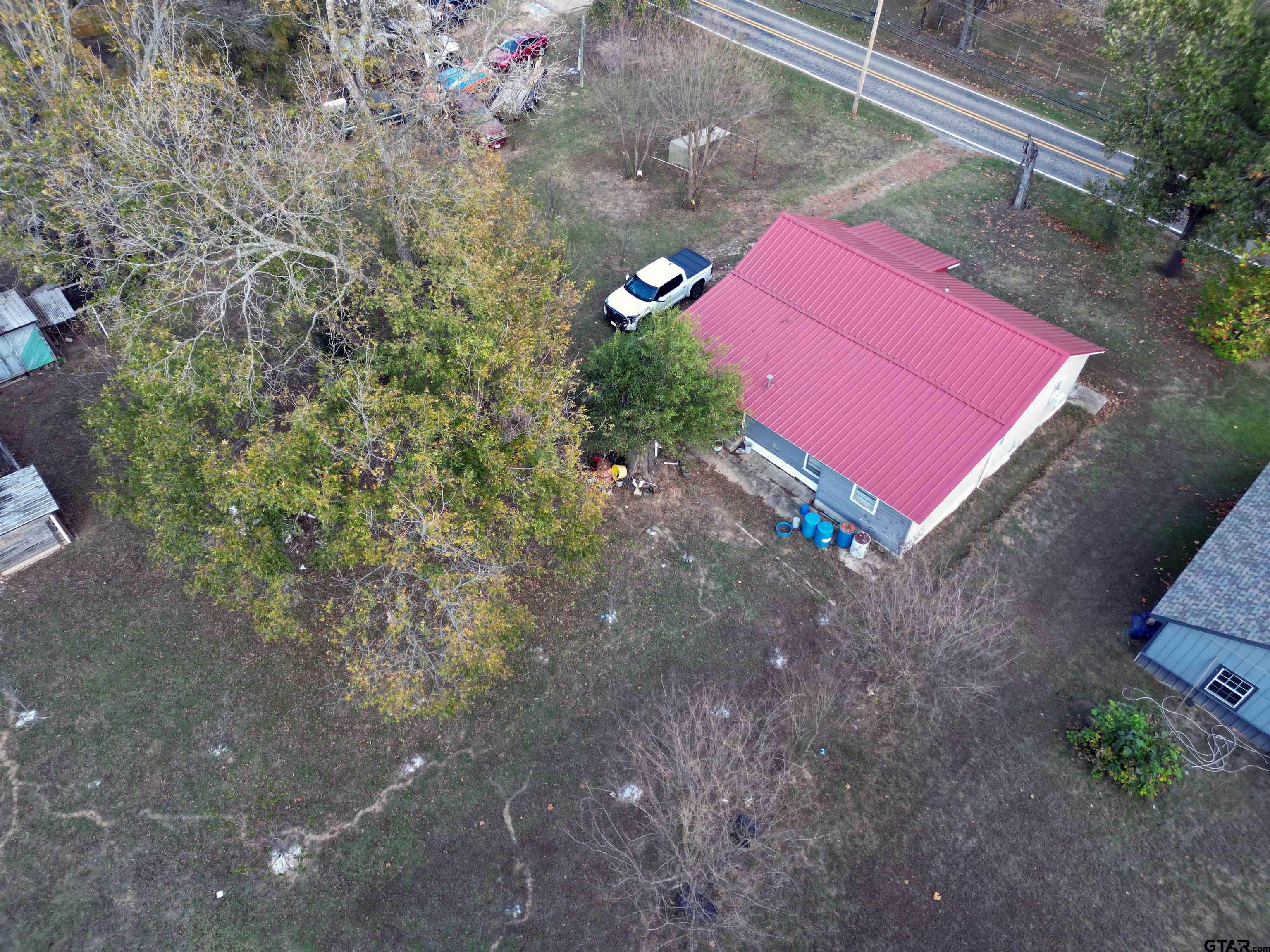 215 Cleveland Street Winfield, TX 75455 - Photo 17 of 17 a view of a backyard