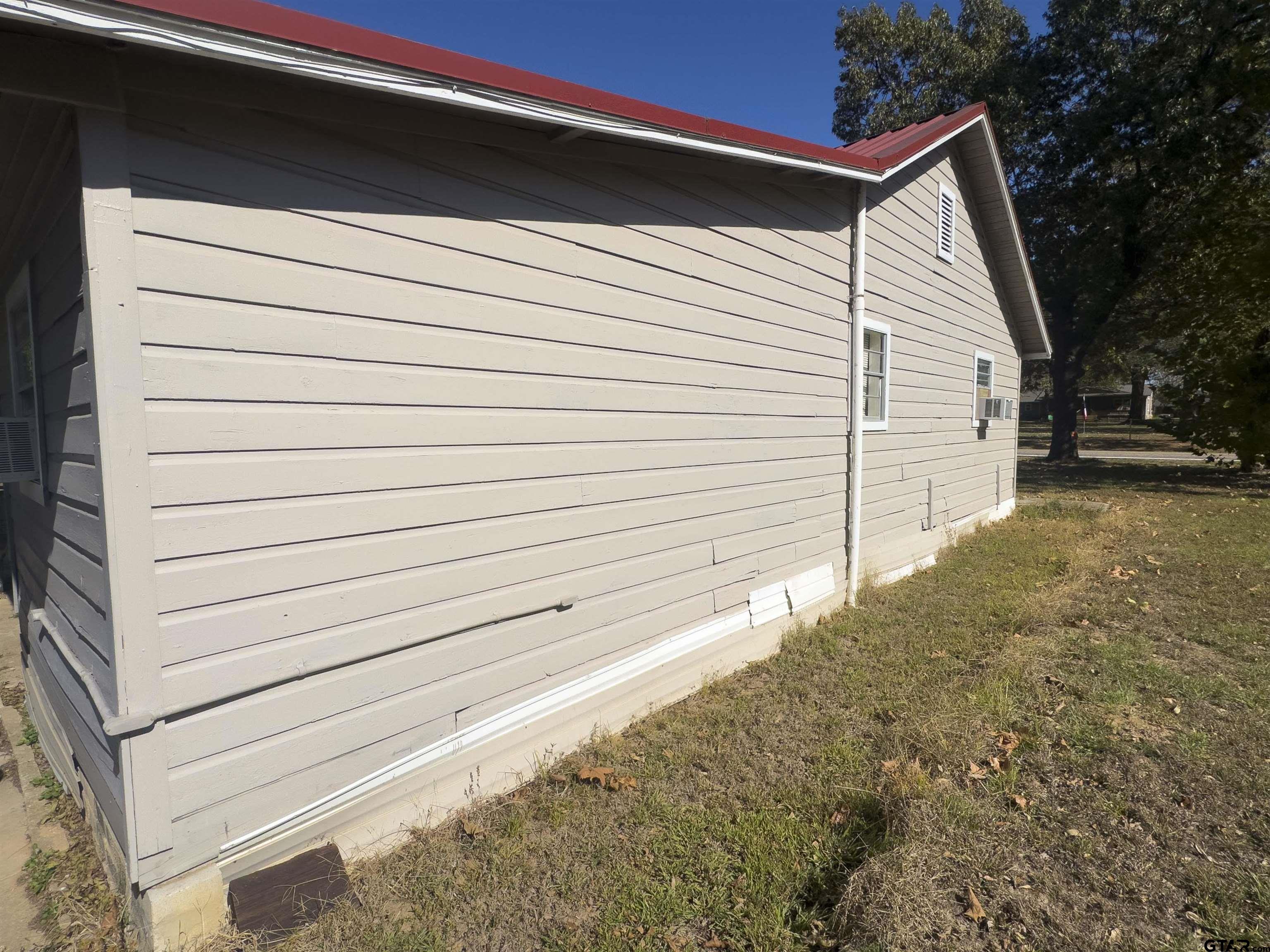 215 Cleveland Street Winfield, TX 75455 - Photo 3 of 17 a view of a backyard