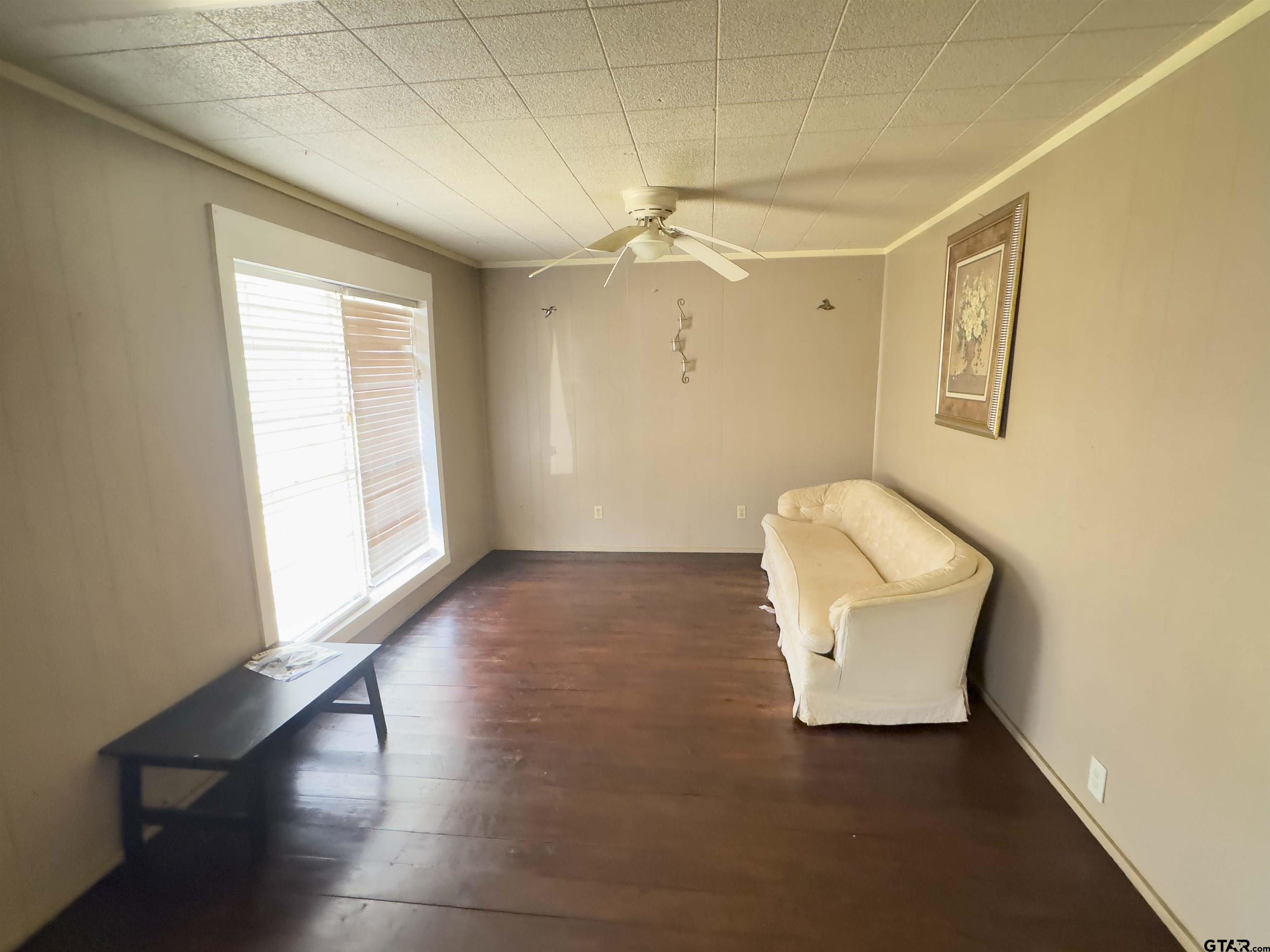 215 Cleveland Street Winfield, TX 75455 - Photo 8 of 17 a view of an empty room with a window