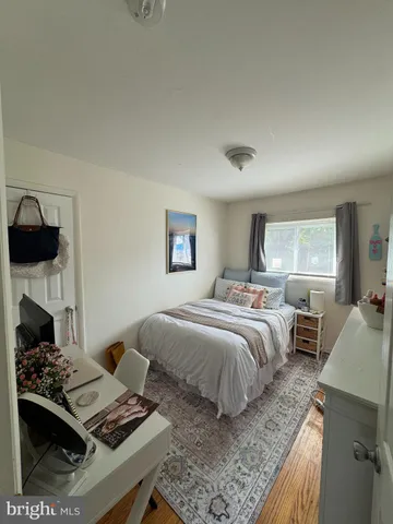 a bedroom with a bed and a fireplace