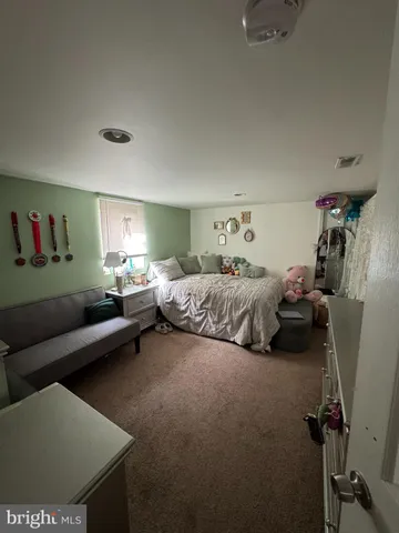 a bedroom with furniture and a bed