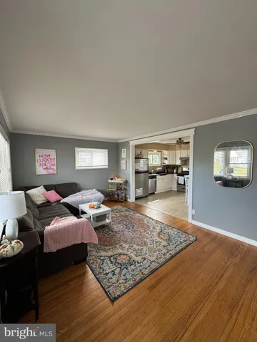 a living room with furniture and a rug