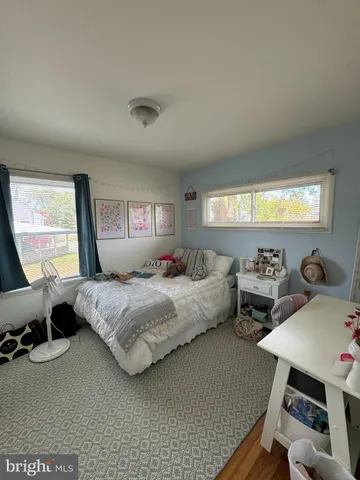 a bedroom with bed and window