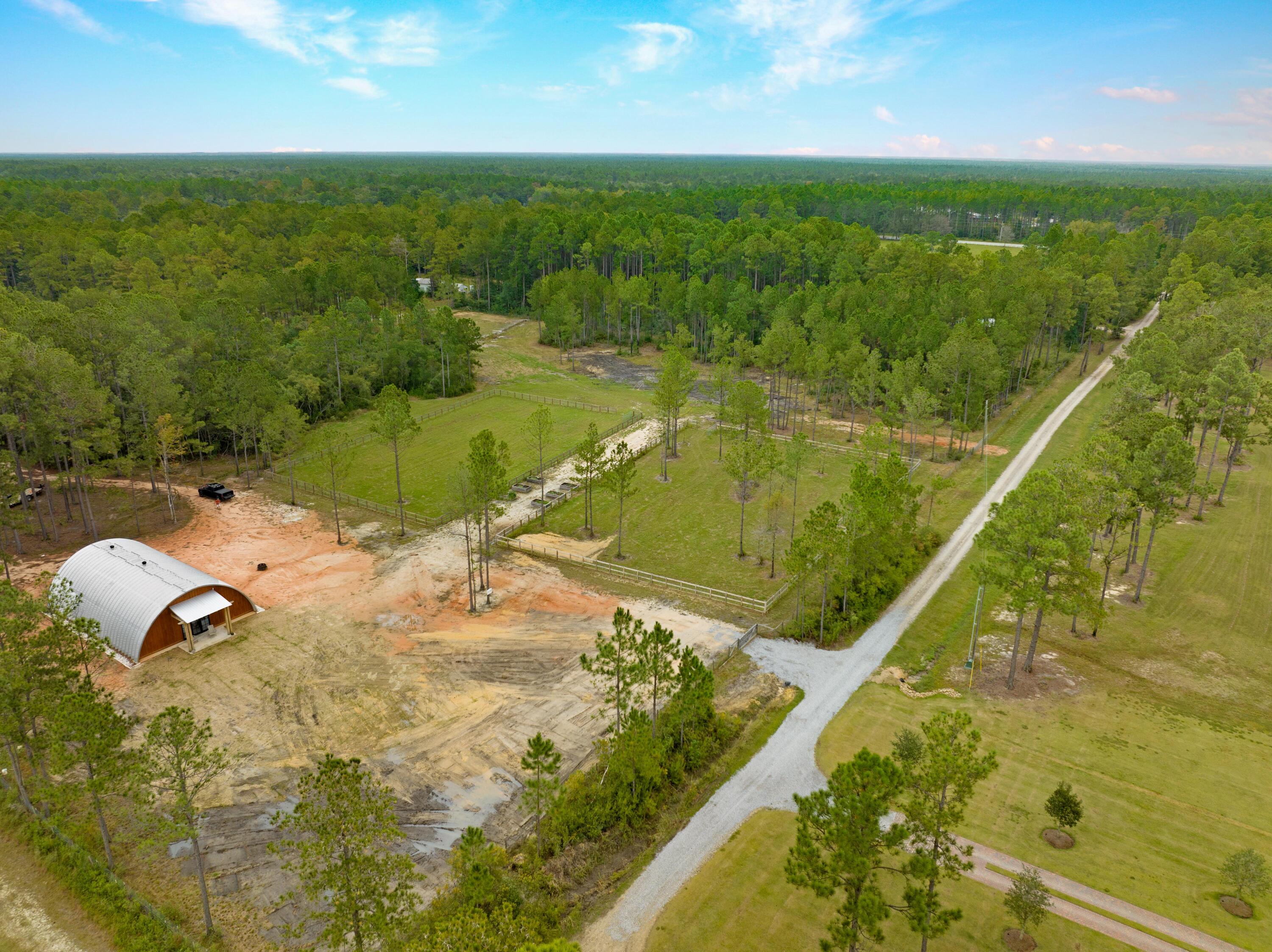 215 Weed Patch Drive Freeport, FL 32439 - Photo 19 of 27 a view of a swimming pool and an outdoor seating