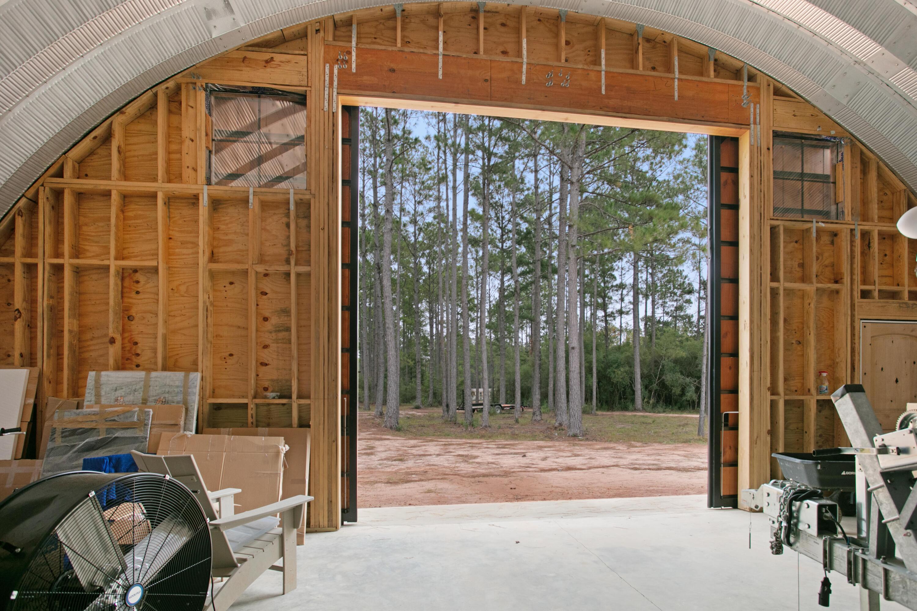 215 Weed Patch Drive Freeport, FL 32439 - Photo 8 of 27 a view of a porch with a table and chairs