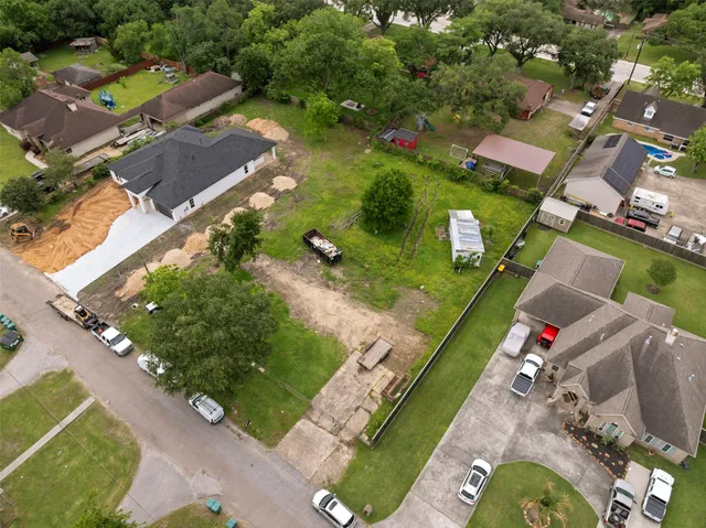 an aerial view of a house with a garden