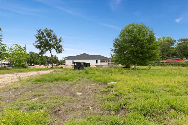 a view of backyard with green space