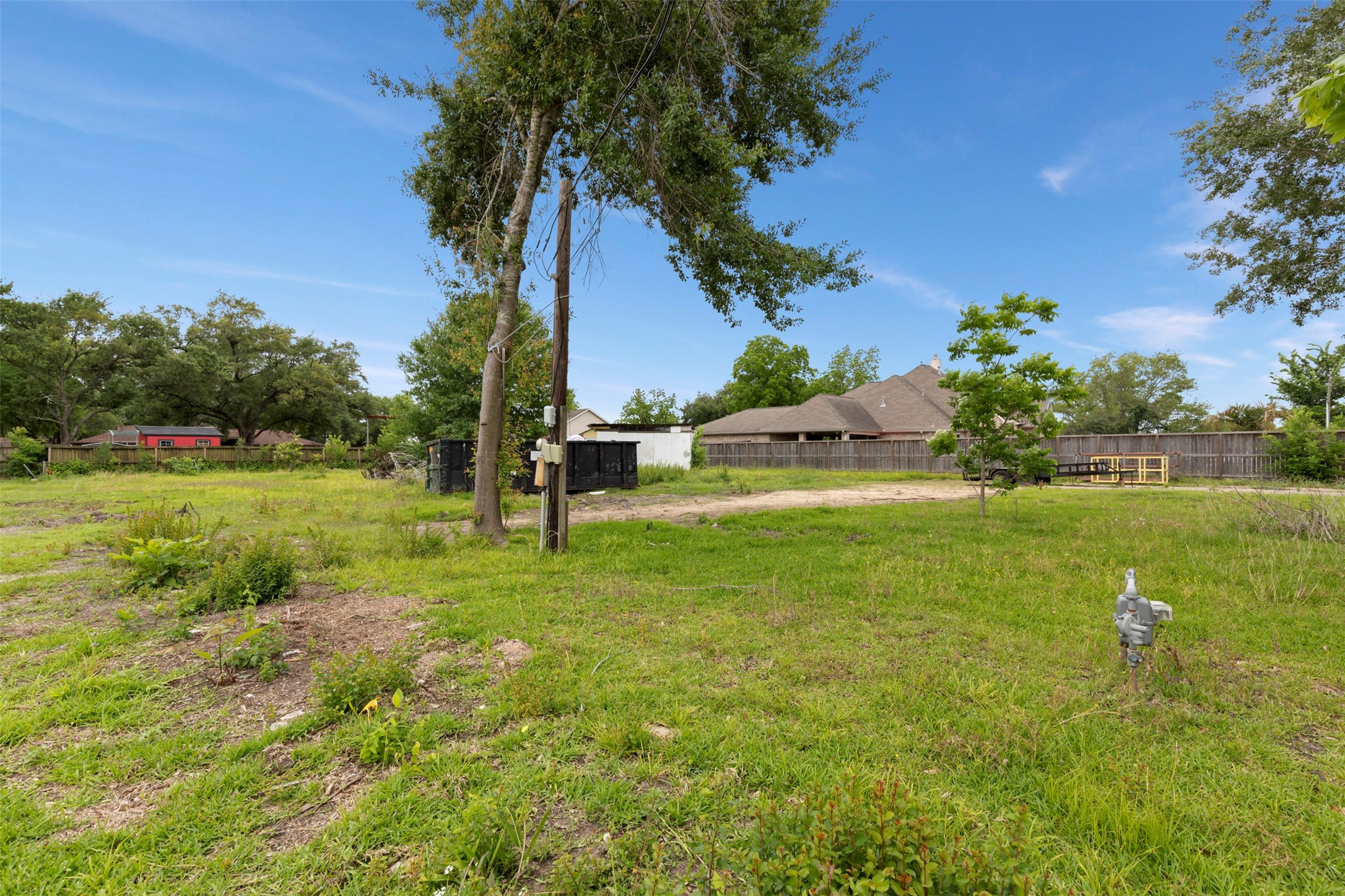 410 Spring Drive Pasadena, TX 77504 - Photo 8 of 18 a view of a garden with a building in the background