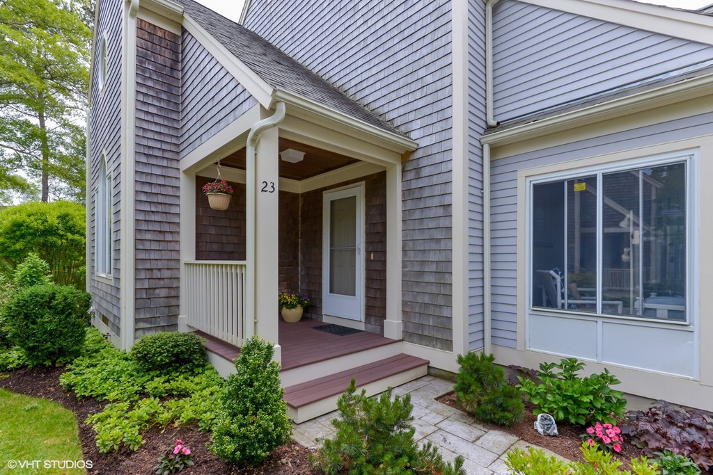 23 Gold Leaf Lane, Unit 23 Mashpee, MA 02649 - Photo 2 of 15 a view of a house with potted plants