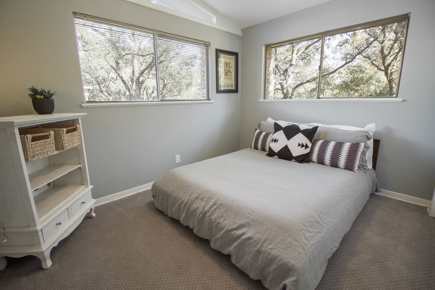 1913 Rabb Road, Unit B Austin, TX 78704 - Photo 9 of 10 Well-lit sleeping quarters with broad window views and practical storage.