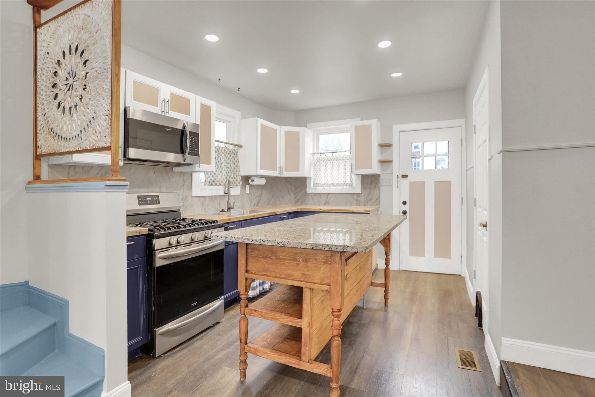 513 Poplar Street Lancaster, PA 17603 - Photo 11 of 41 a kitchen with stainless steel appliances granite countertop a stove and a sink