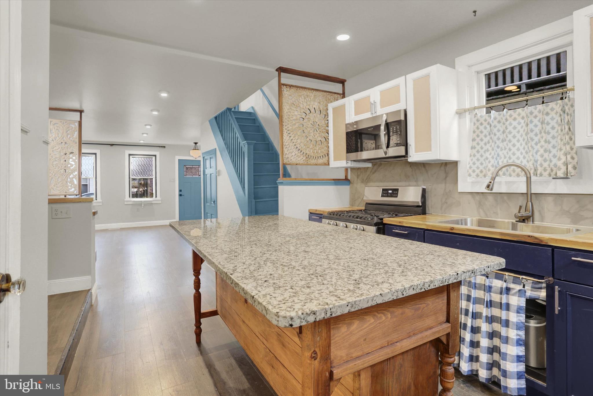 513 Poplar Street Lancaster, PA 17603 - Photo 14 of 41 a kitchen with stainless steel appliances granite countertop a sink stove and refrigerator