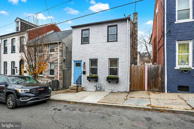 a car parked in front of a house