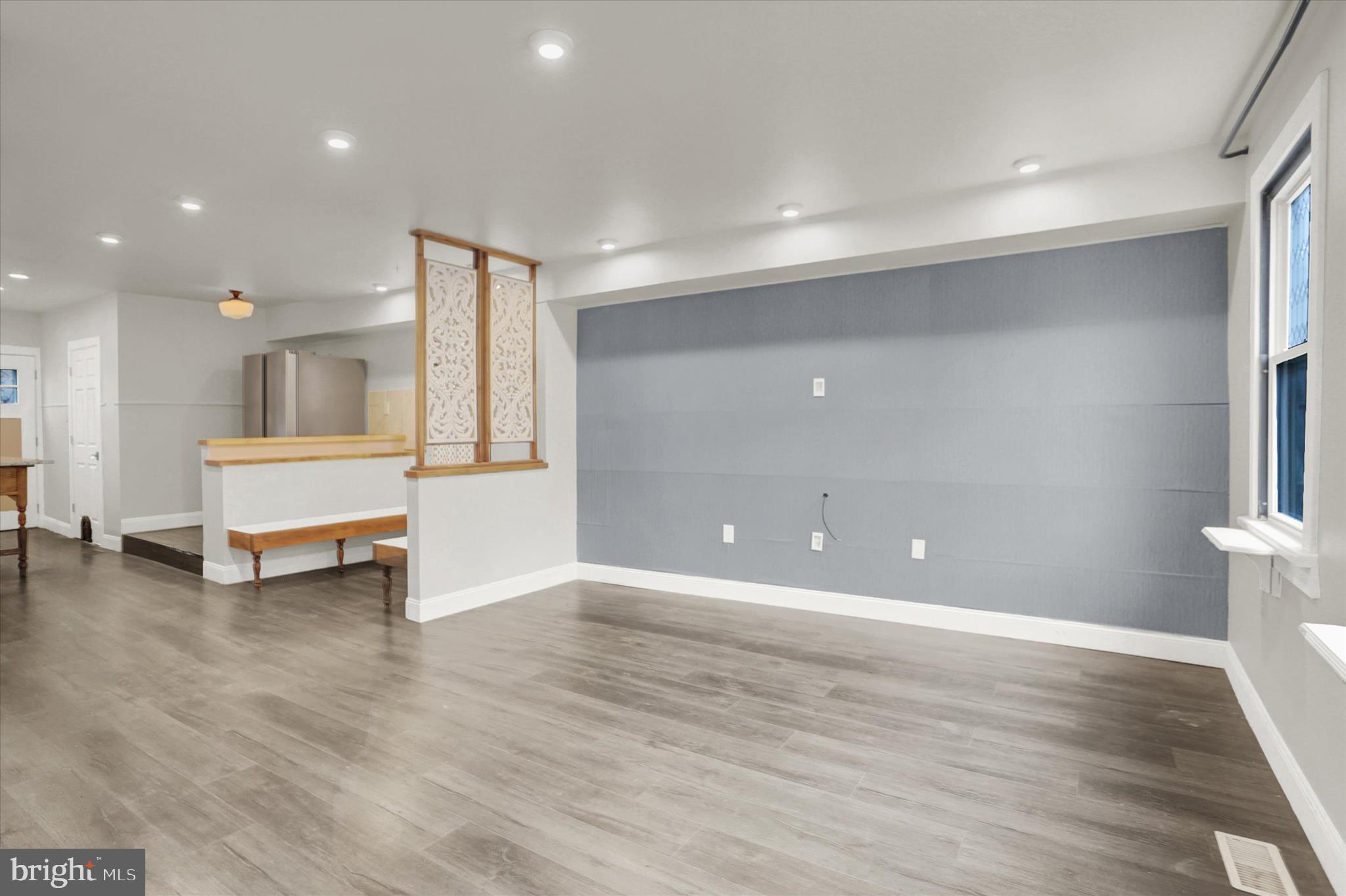 513 Poplar Street Lancaster, PA 17603 - Photo 8 of 41 a view of an empty room with wooden floor and windows