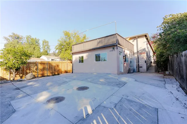 a view of a house with a yard and garage