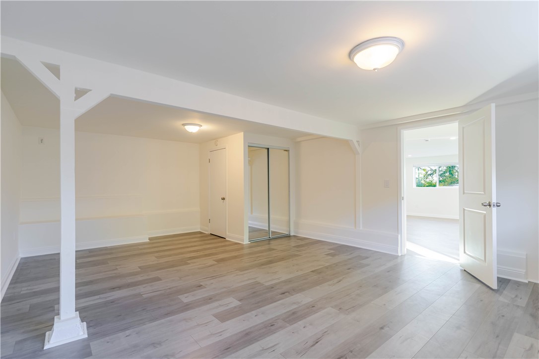 10528 1/4 Hillhaven Avenue Tujunga, CA 91042 - Photo 8 of 13 a view of an empty room with wooden floor