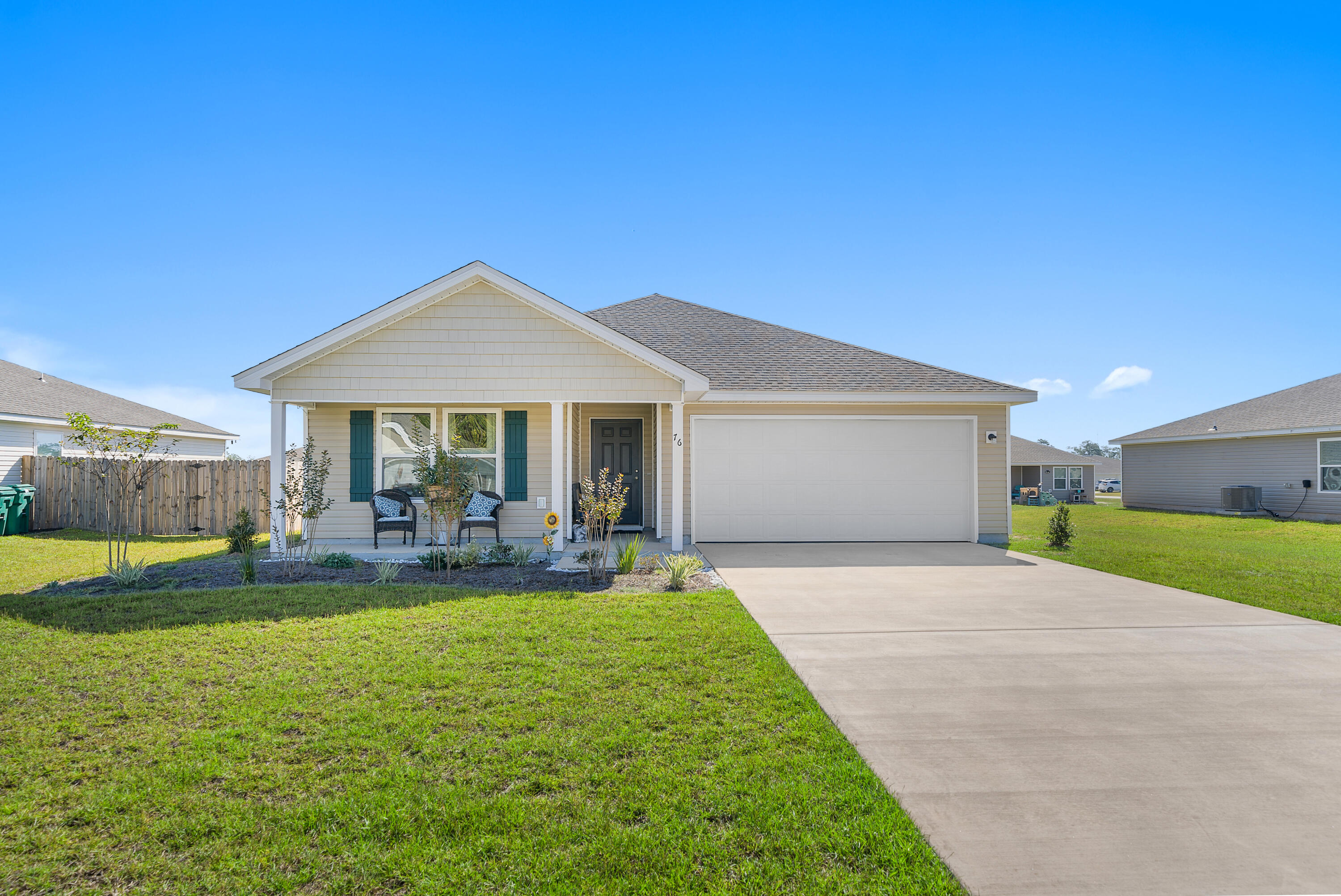 a front view of house with yard and outdoor seating