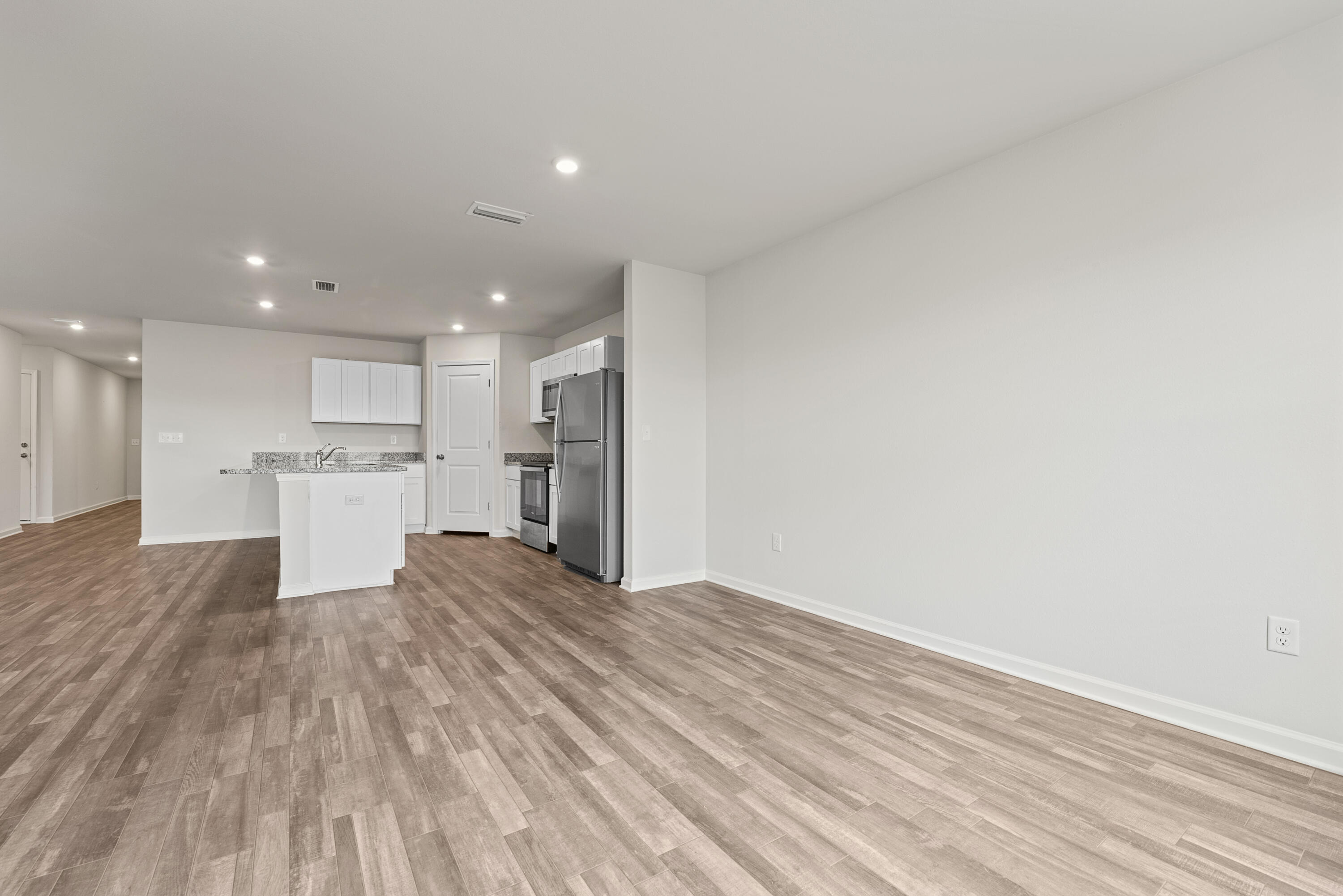 76 Cora Road DeFuniak Springs, FL 32433 - Photo 11 of 27 a view of kitchen with wooden floor