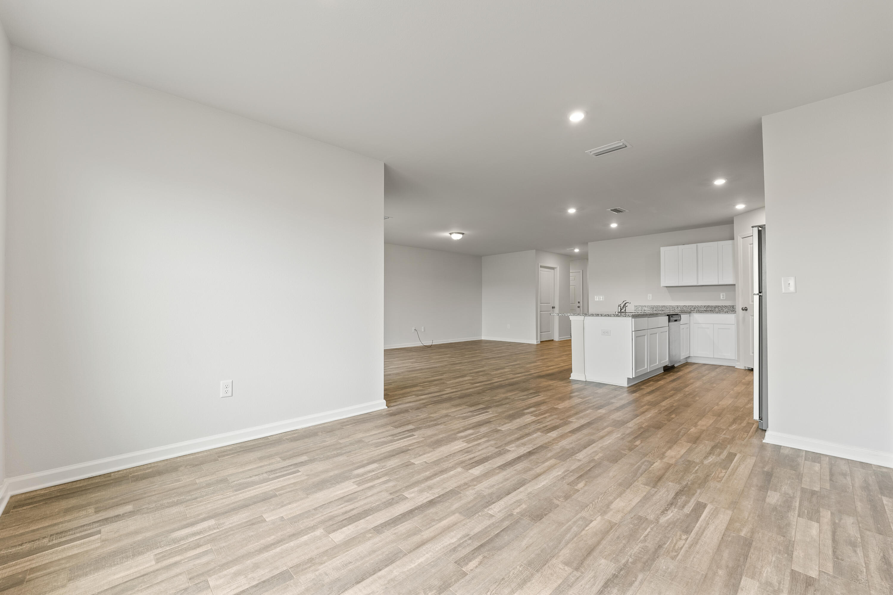 76 Cora Road DeFuniak Springs, FL 32433 - Photo 12 of 27 a view of kitchen with wooden floor