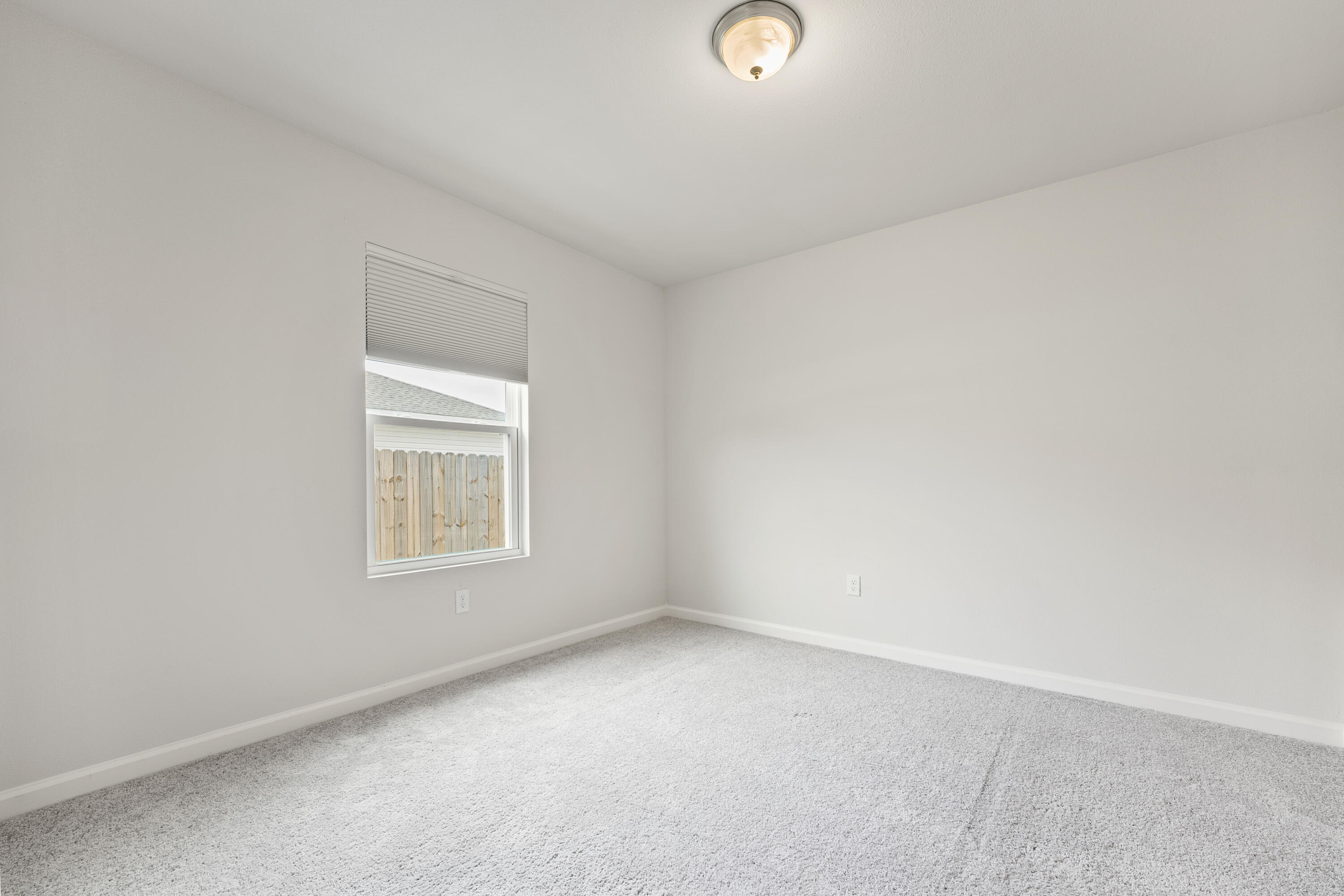 76 Cora Road DeFuniak Springs, FL 32433 - Photo 19 of 27 an empty room with a window