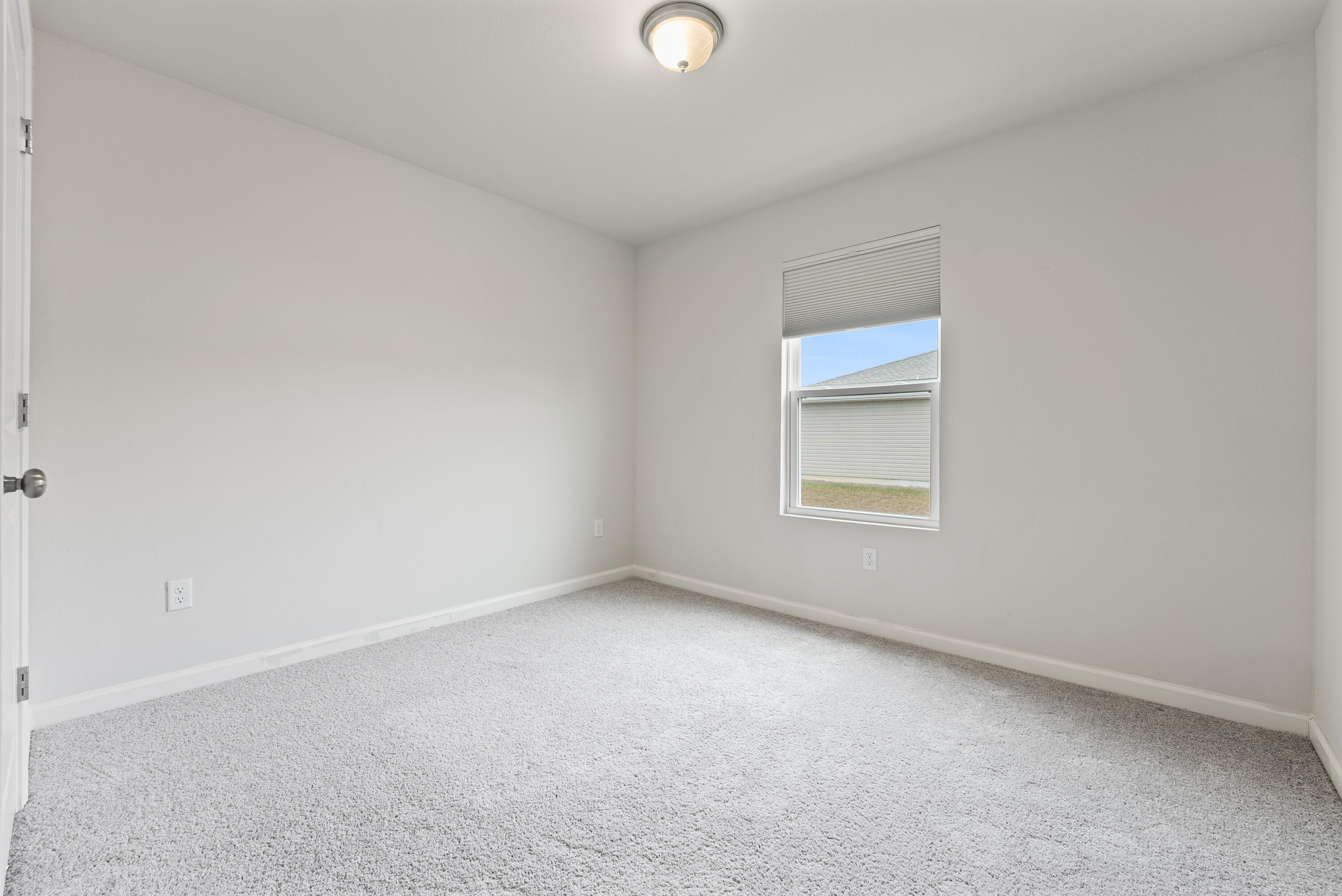 76 Cora Road DeFuniak Springs, FL 32433 - Photo 23 of 27 a view of an empty room with a window