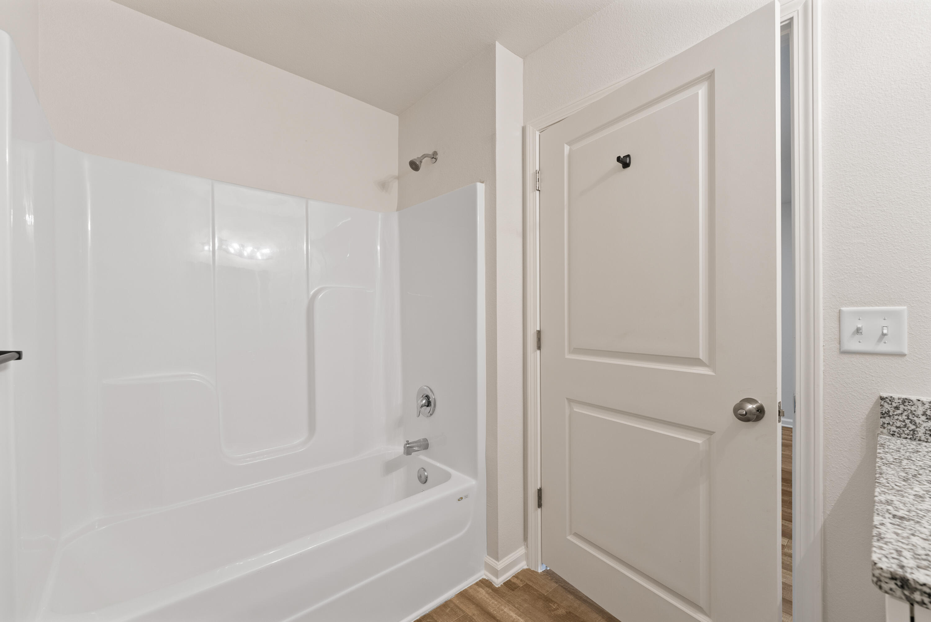 76 Cora Road DeFuniak Springs, FL 32433 - Photo 25 of 27 a bathroom with a bathtub and a shower