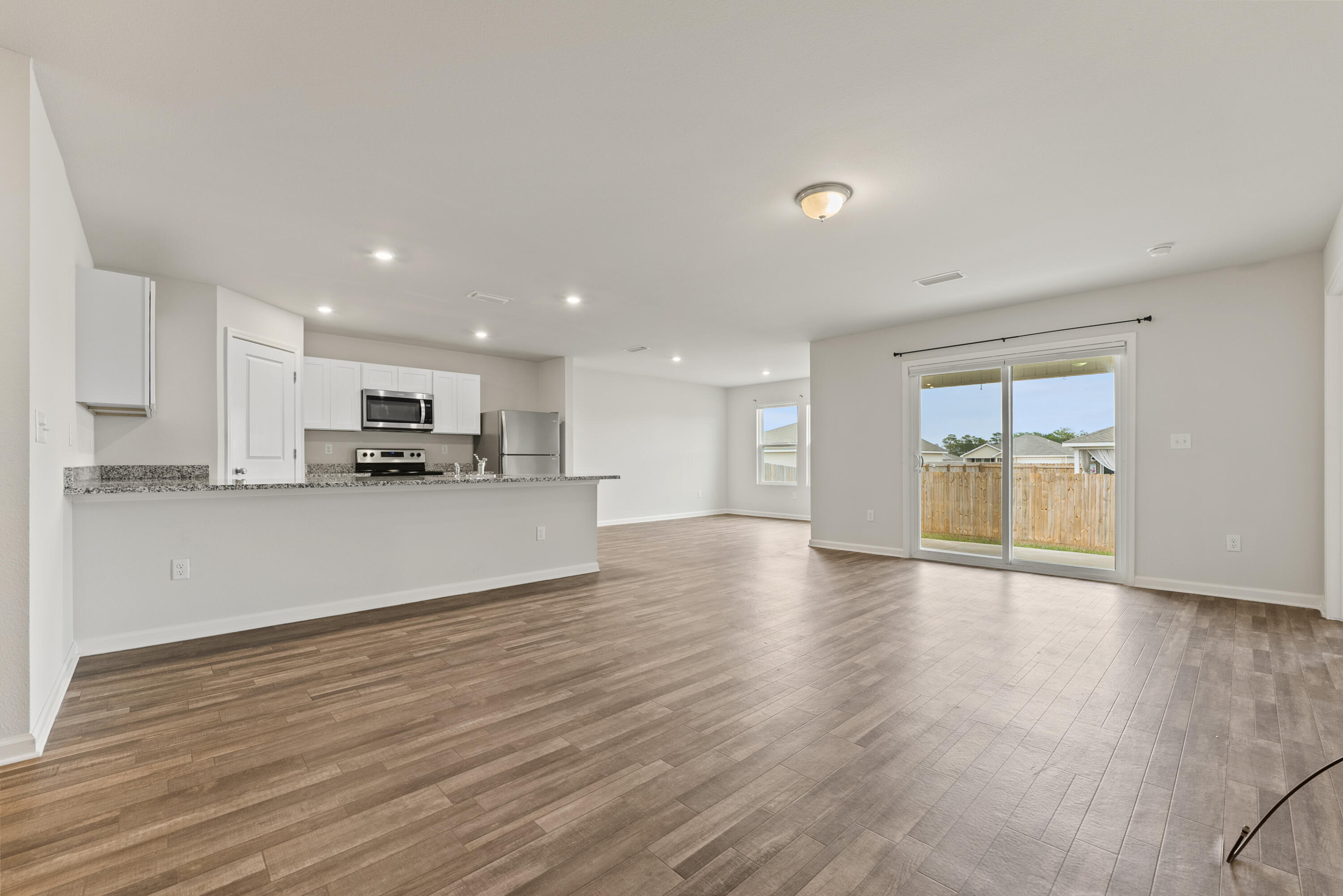 76 Cora Road DeFuniak Springs, FL 32433 - Photo 4 of 27 a view of kitchen with wooden floor and a sink