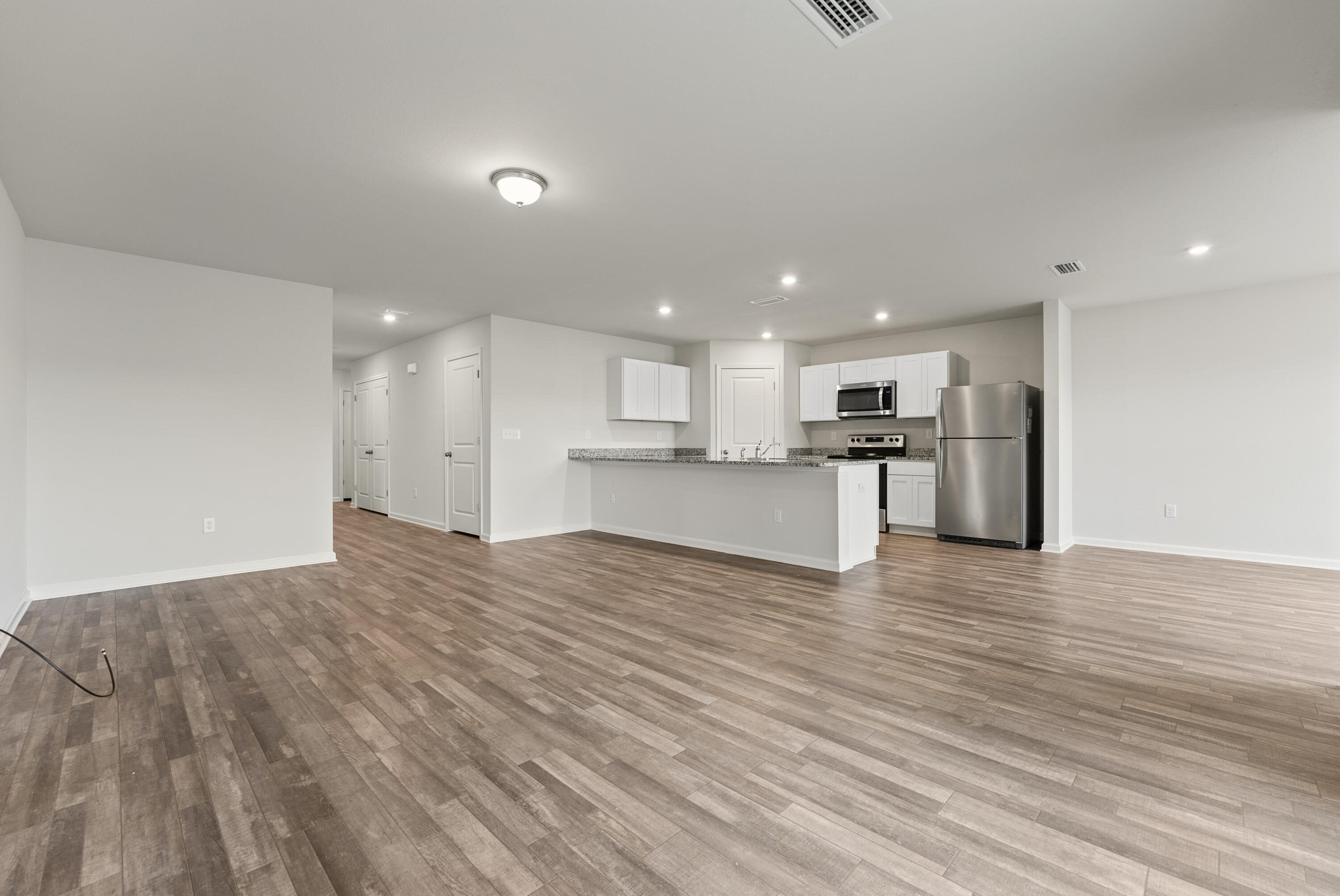 76 Cora Road DeFuniak Springs, FL 32433 - Photo 6 of 27 a view of kitchen with wooden floor