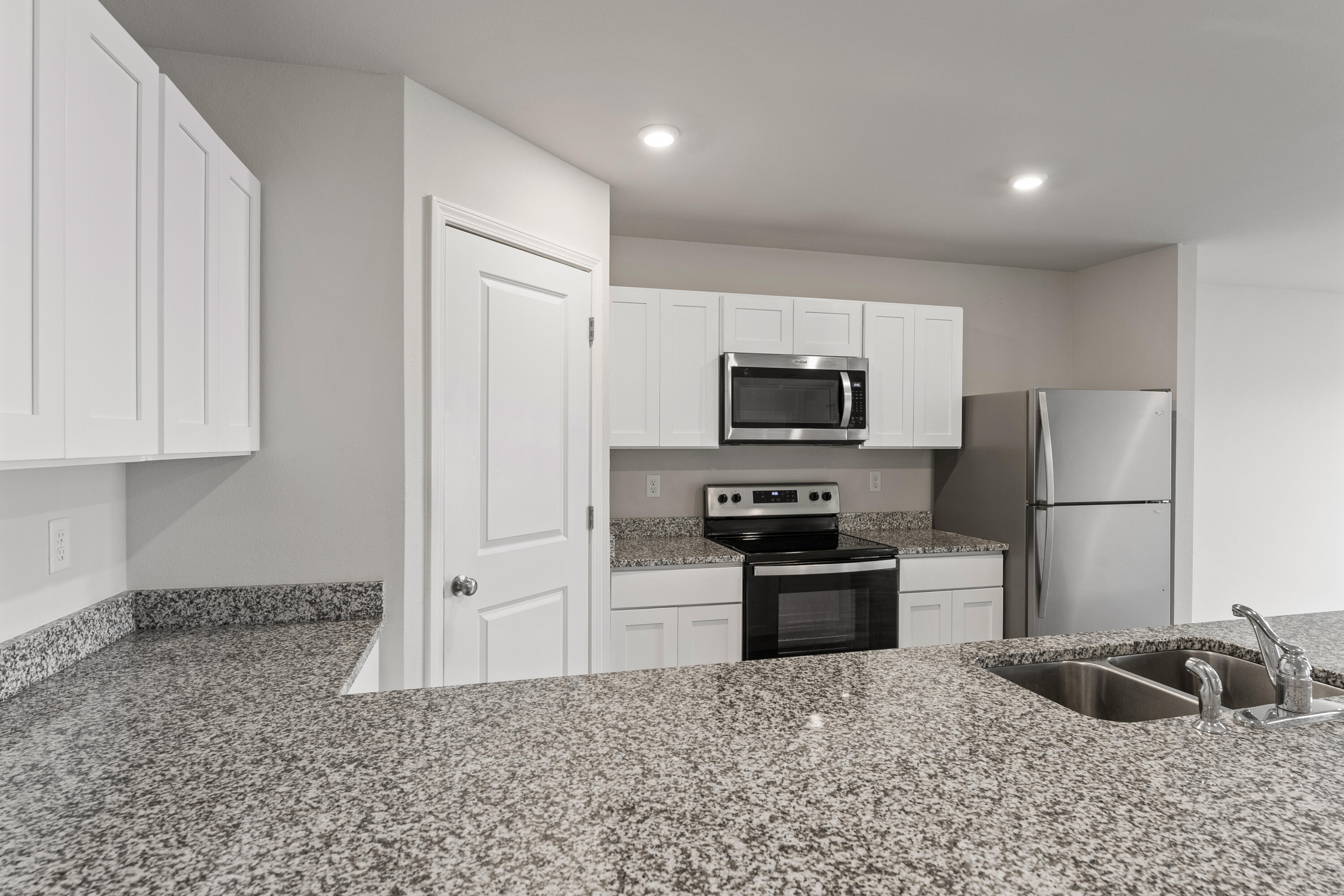 76 Cora Road DeFuniak Springs, FL 32433 - Photo 9 of 27 a kitchen with stainless steel appliances granite countertop a refrigerator a stove a sink and a granite counter tops