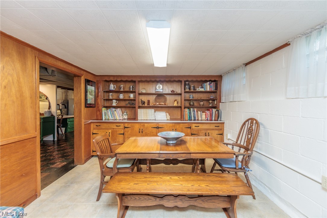 26585 Cook Road Olmsted Falls, OH 44138 - Photo 23 of 34 Dining area with built in shelves and light tile floors