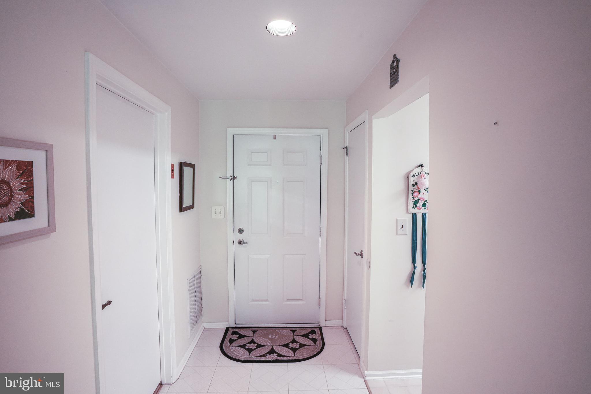 381 Silvia Street Ewing, NJ 08628 - Photo 3 of 20 Foyer Area- Washer/ Dryer Room to the left