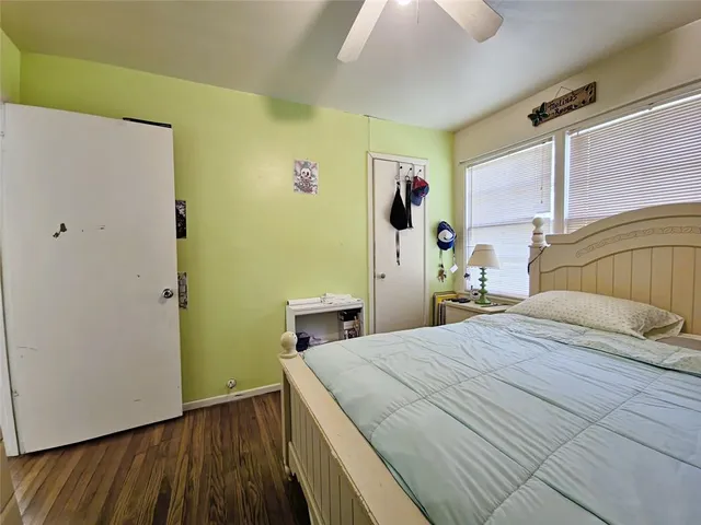 a bedroom with a bed and a dresser