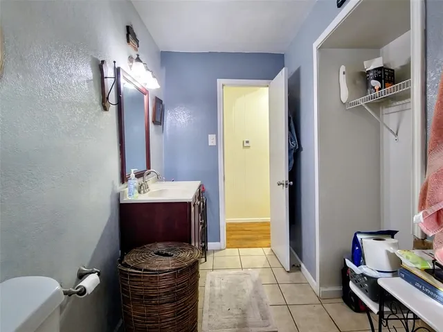 a bathroom with a mirror and a sink