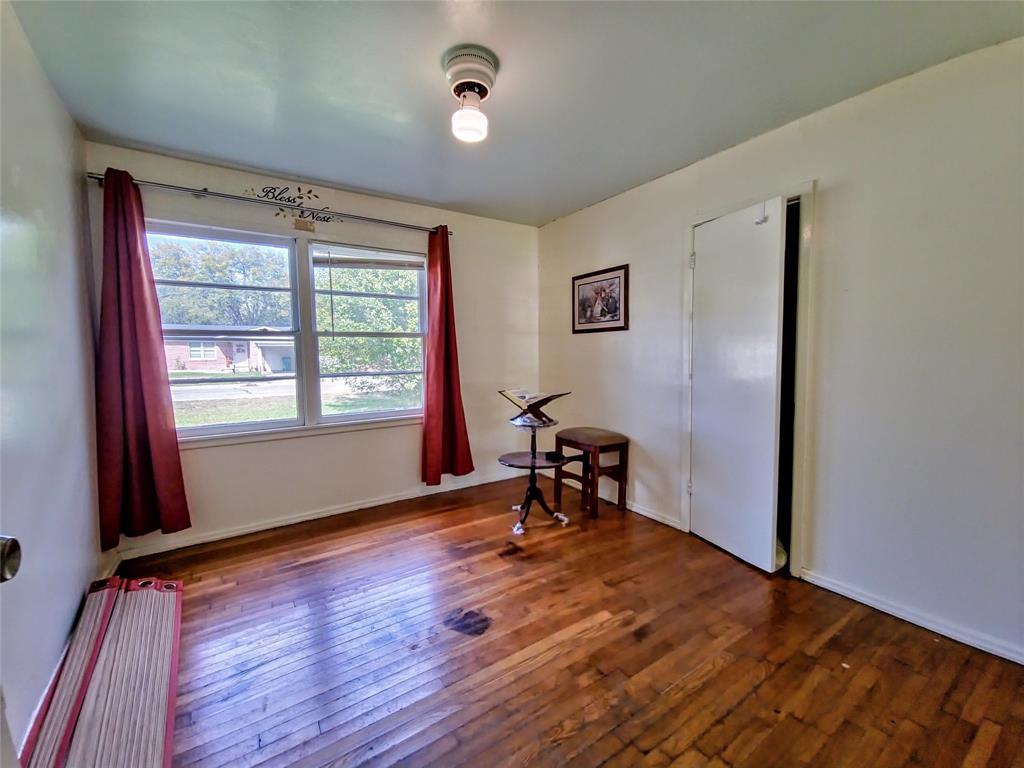 140 Meadowbrook Street Robinson, TX 76706 - Photo 19 of 37 a view of a livingroom with wooden floor and a window