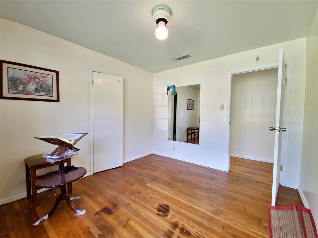 140 Meadowbrook Street Robinson, TX 76706 - Photo 20 of 37 a bedroom with a bed and a chair