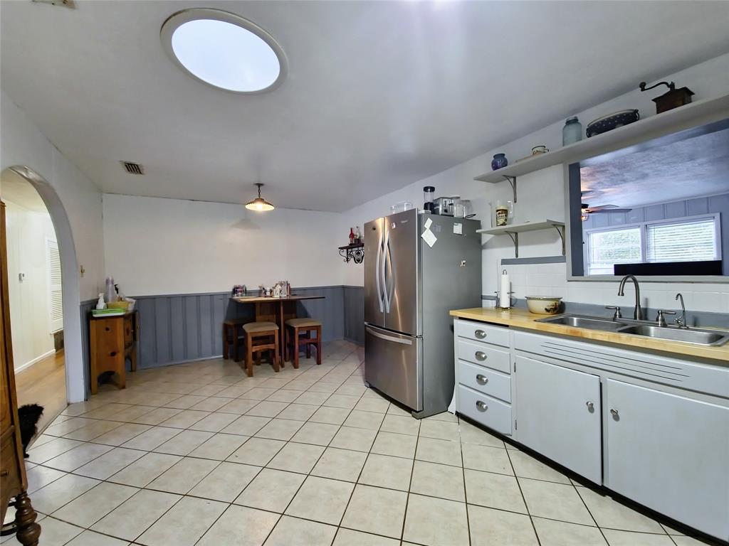 140 Meadowbrook Street Robinson, TX 76706 - Photo 22 of 37 a kitchen with stainless steel appliances a refrigerator and a sink