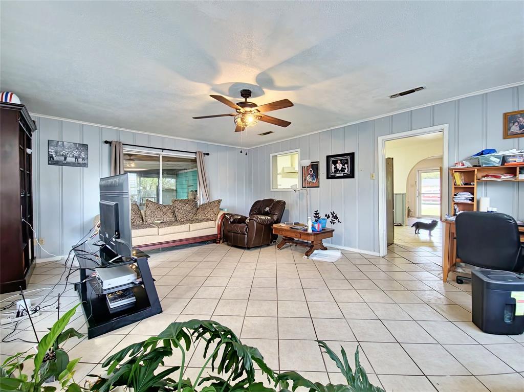 140 Meadowbrook Street Robinson, TX 76706 - Photo 27 of 37 a living room with furniture a window and a flat screen tv