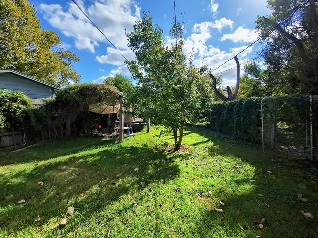 a backyard of a house with lots of green space