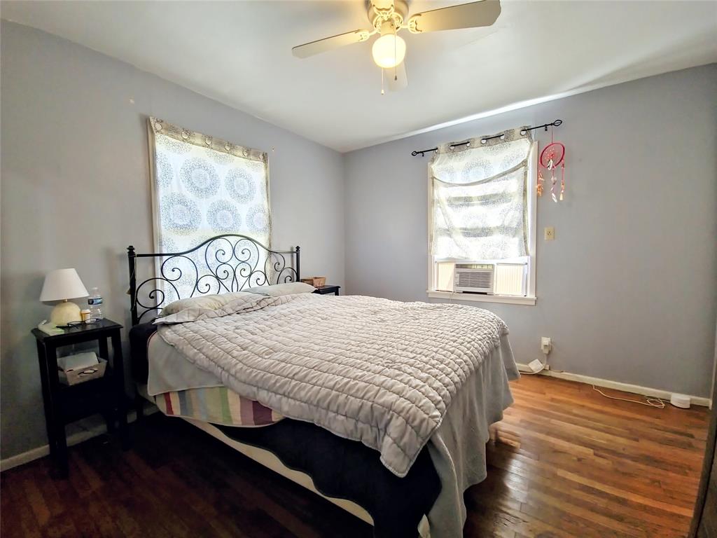 140 Meadowbrook Street Robinson, TX 76706 - Photo 5 of 37 a bedroom with a large bed and a window