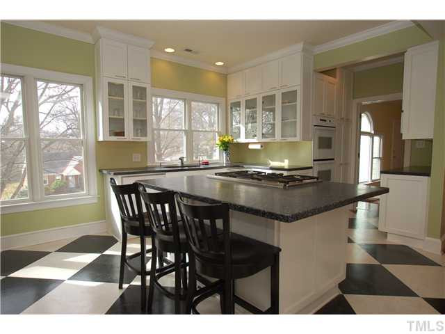 1612 Oberlin Road, Unit 5 Raleigh, NC 27608 - Photo 10 of 25 Center wall and hall were taken away and the space incorporated to create this open, gourmet kitchenand eating areas. Kitchen