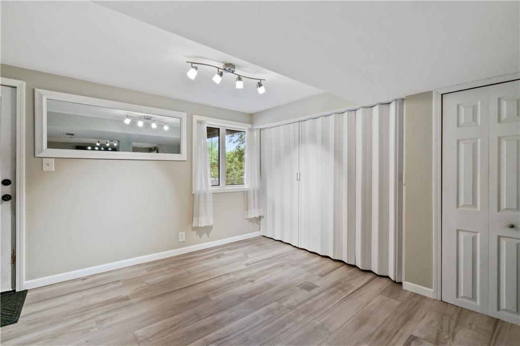 5431 Hamilton Road Gibsonia, PA 15044 - Photo 21 of 28 a view of an empty room with wooden floor and a window
