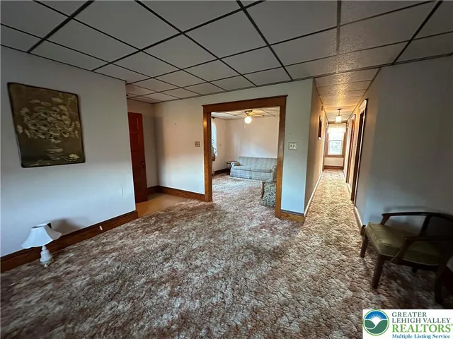 a view of livingroom with furniture and staircase