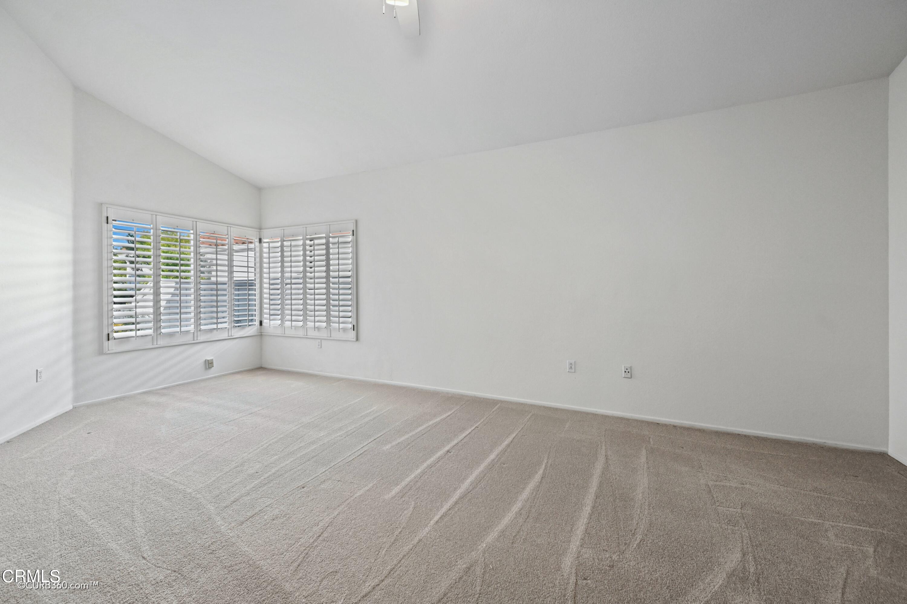 4947 Tilos Way Oceanside, CA 92056 - Photo 13 of 37 an empty room with windows