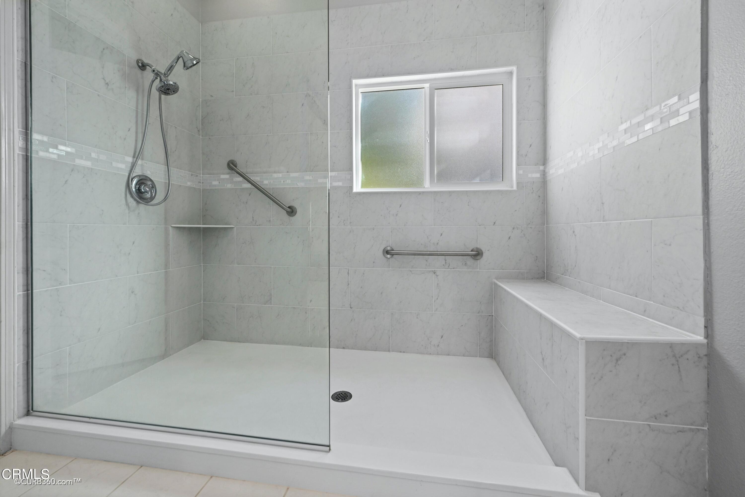 4947 Tilos Way Oceanside, CA 92056 - Photo 19 of 37 a bathroom with a shower