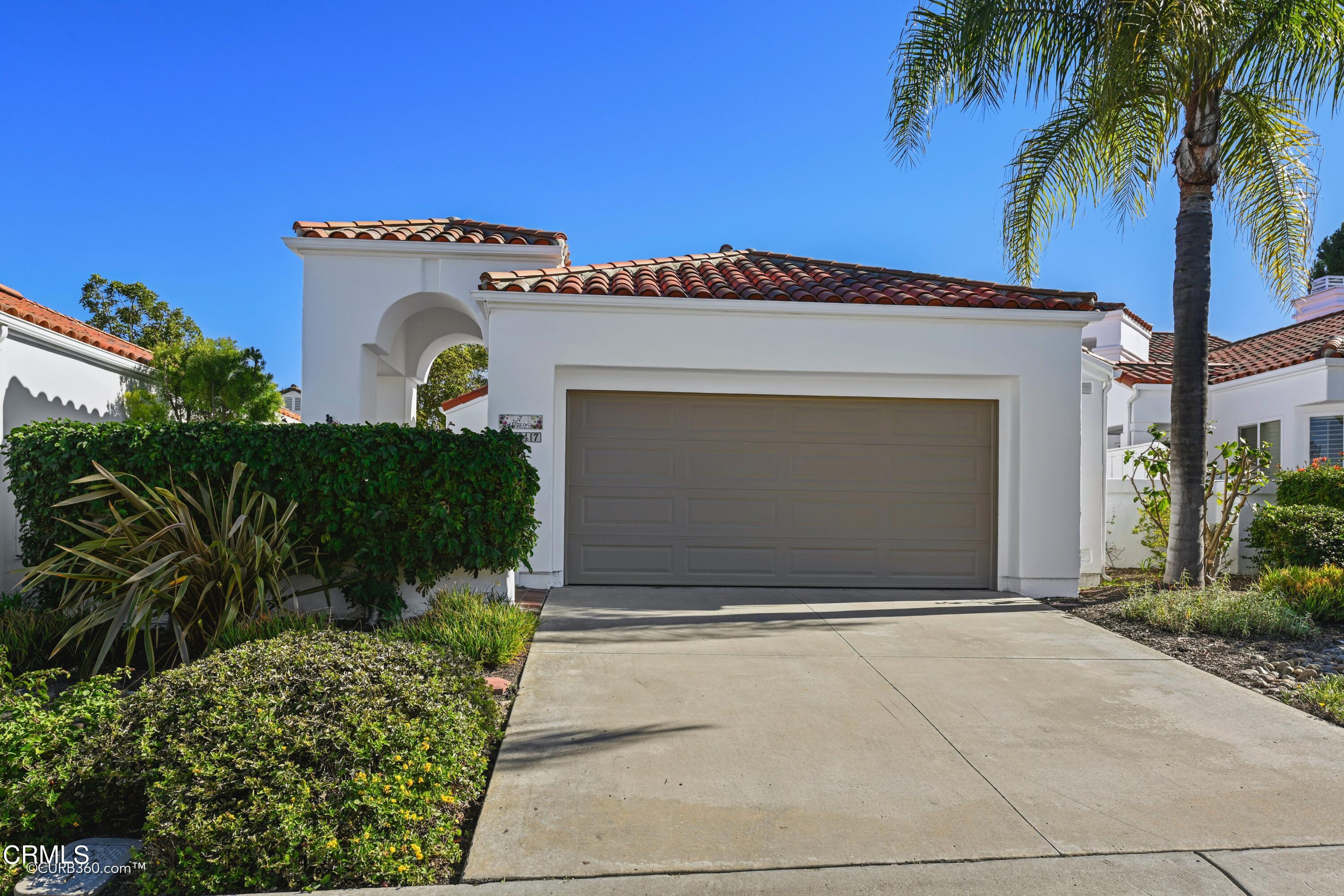 4947 Tilos Way Oceanside, CA 92056 - Photo 2 of 37 a front view of a house with a garage