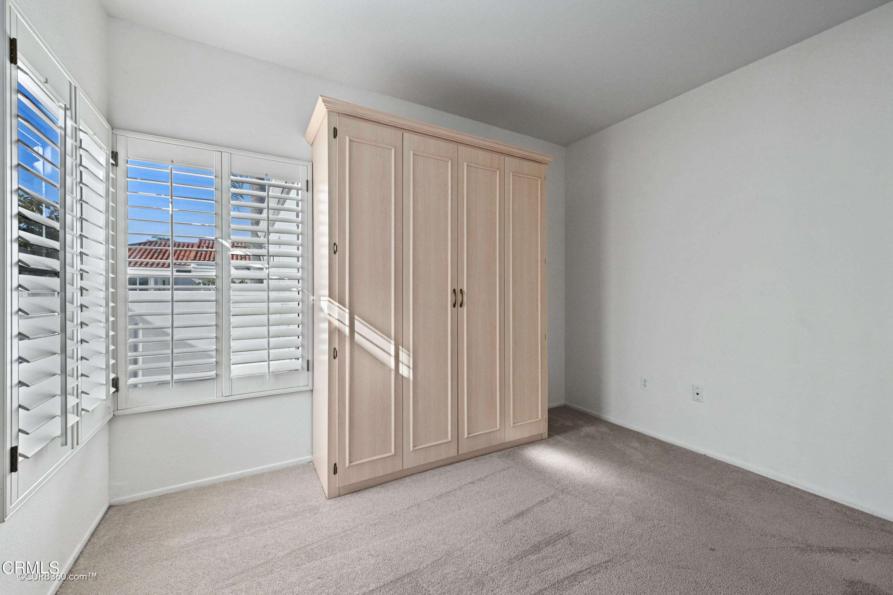 4947 Tilos Way Oceanside, CA 92056 - Photo 23 of 37 an empty room with windows