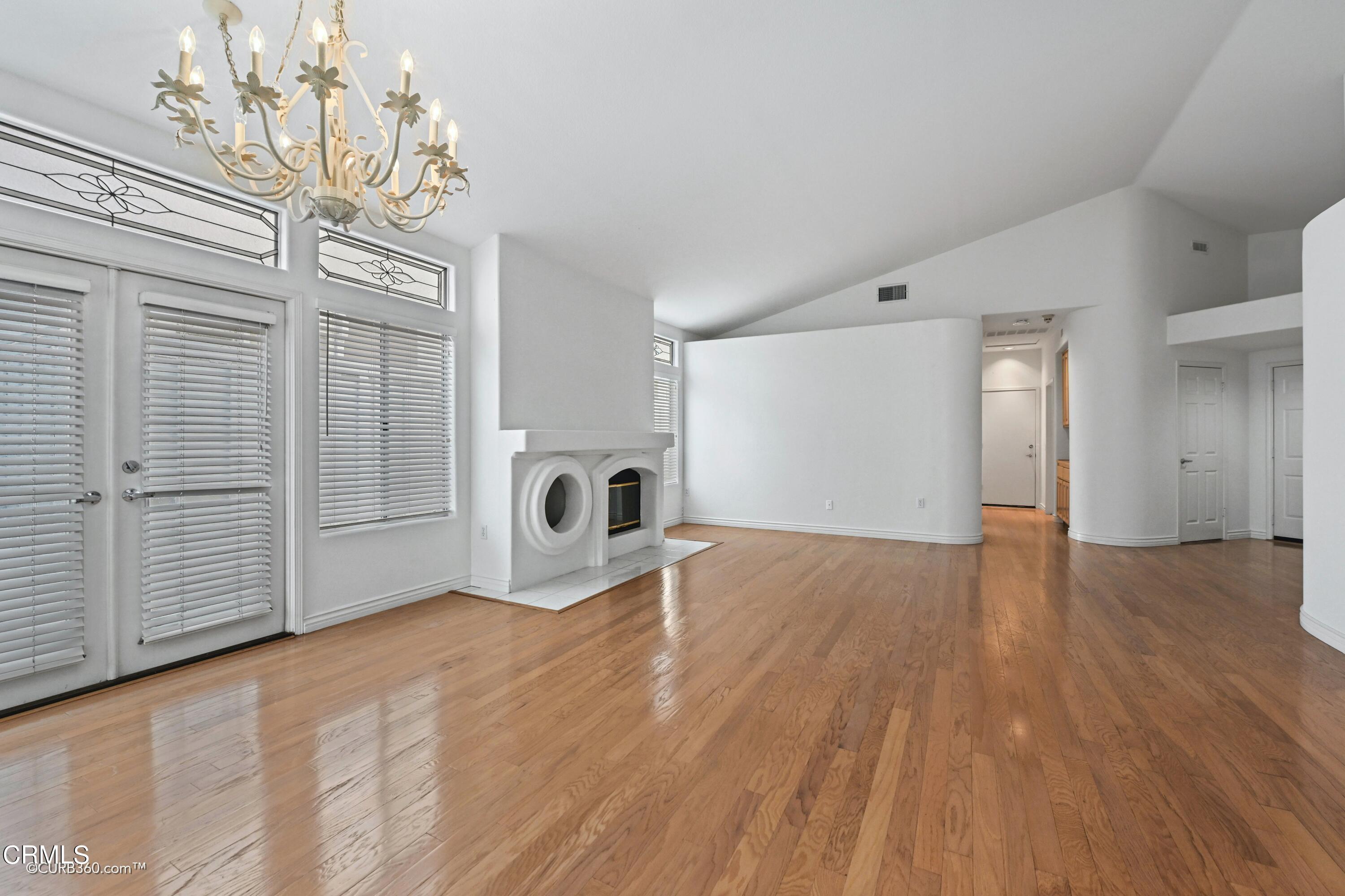 4947 Tilos Way Oceanside, CA 92056 - Photo 5 of 37 a view of empty room with wooden floor