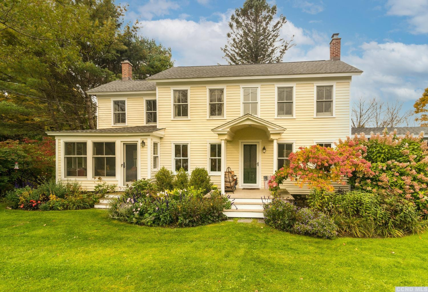 56 Beebe Pond Road Canaan, NY 12029 - Photo 1 of 50 a front view of a house with a garden