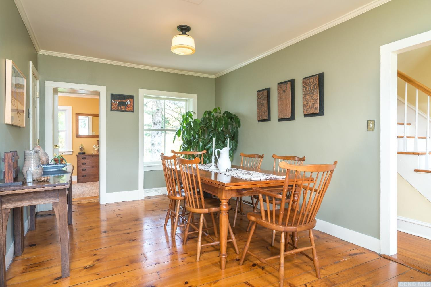 56 Beebe Pond Road Canaan, NY 12029 - Photo 11 of 50 a view of a dining room with furniture and wooden floor